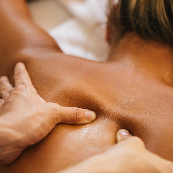 Wellness & relaxation : A skilled therapist giving Deep tissue Massage